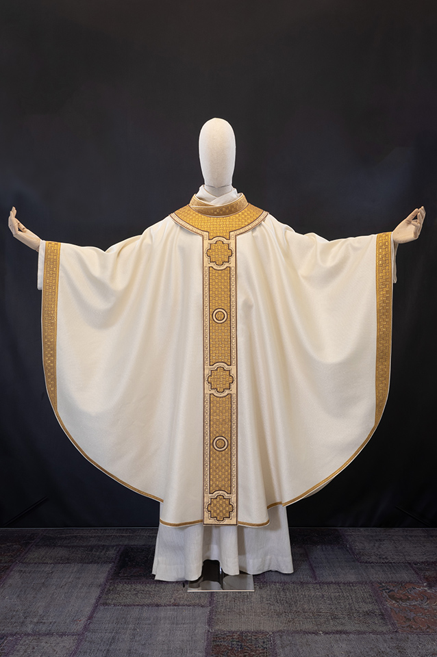White chasuble with gold decorations and studs.
